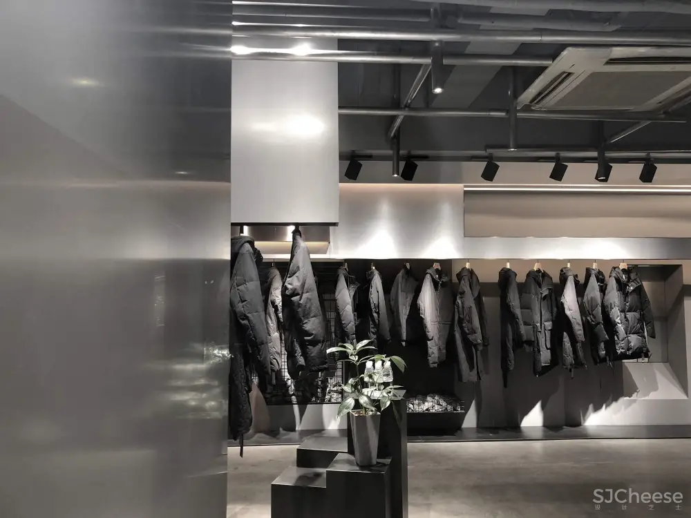 煜哲男装—堆积中的光与影丨术锐室内设计