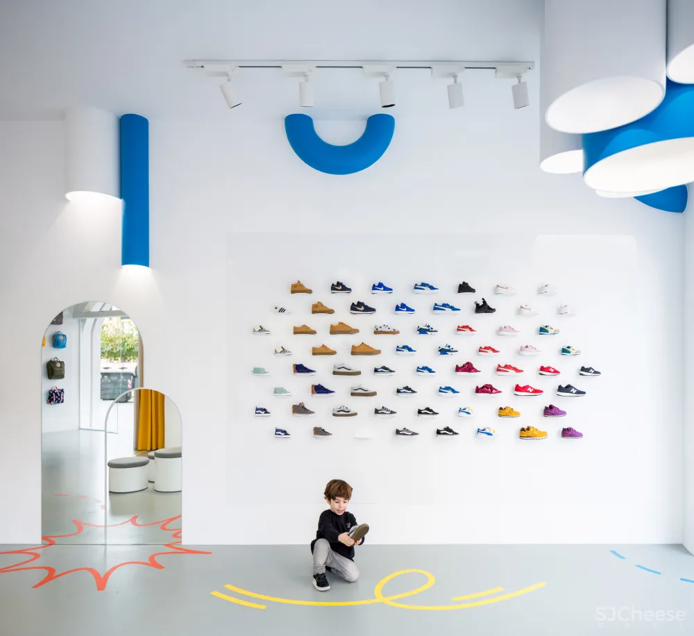 Arched doorways and bold hues feature inside Little Stories shoe store