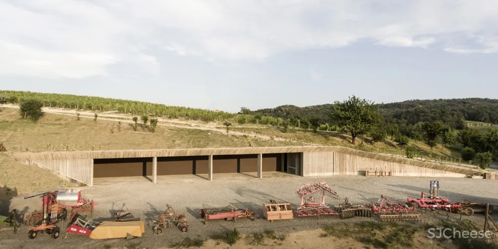 Deamicisarchitetti submerges concrete machinery depot into hillside