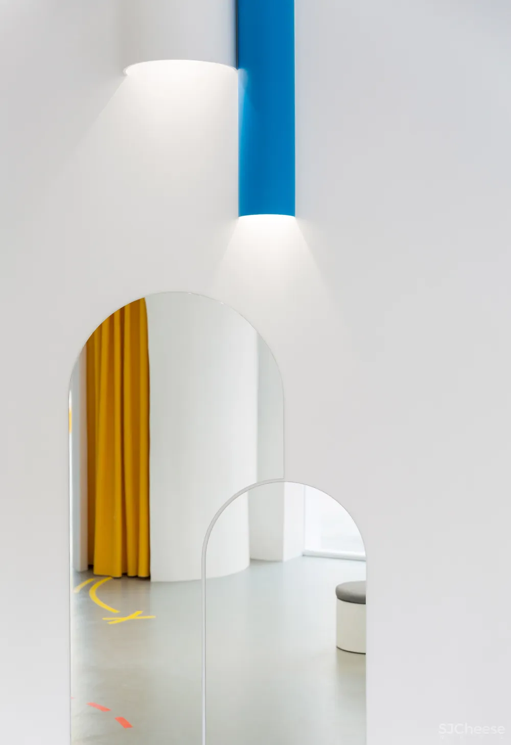 Arched doorways and bold hues feature inside Little Stories shoe store