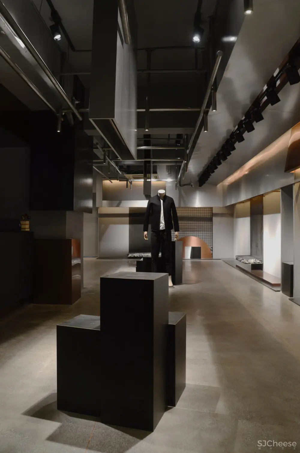 煜哲男装—堆积中的光与影丨术锐室内设计