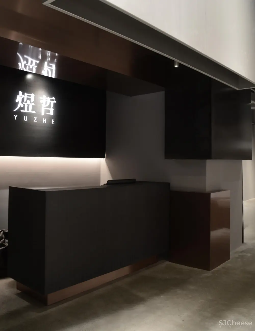 煜哲男装—堆积中的光与影丨术锐室内设计