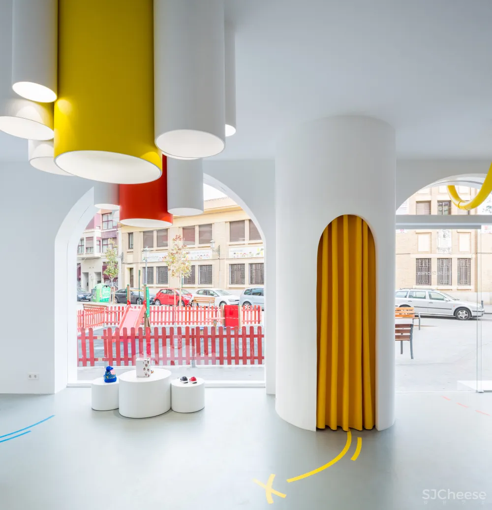 Arched doorways and bold hues feature inside Little Stories shoe store