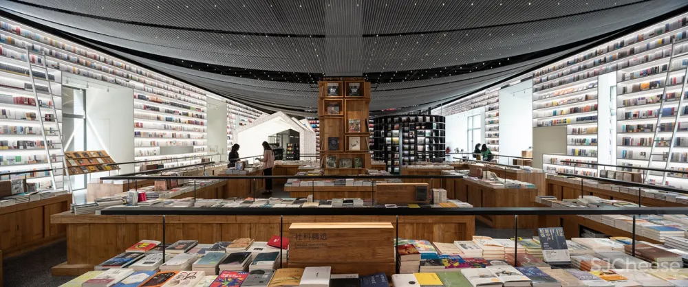 以“街巷”概念延续城市视角与空间体验,Page One 北京坊书店 直向建筑