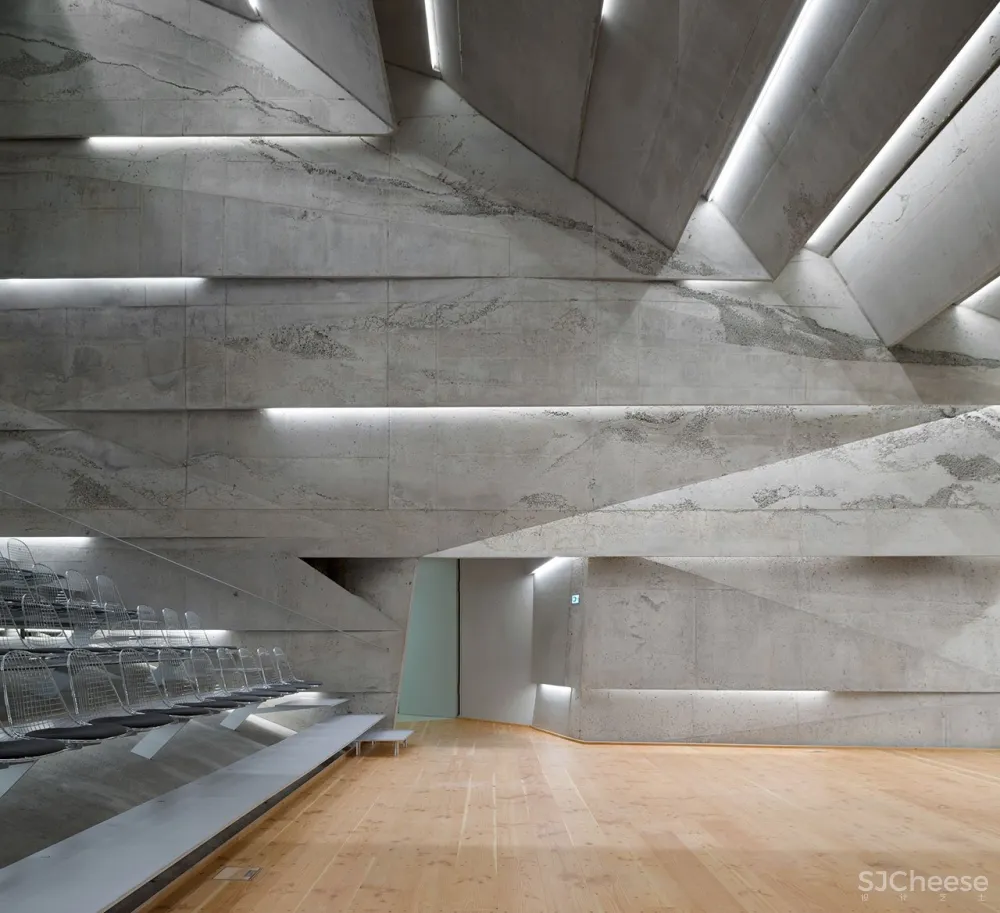 A Tilted, Submerged Concert Hall by Peter Haimerl Architektur