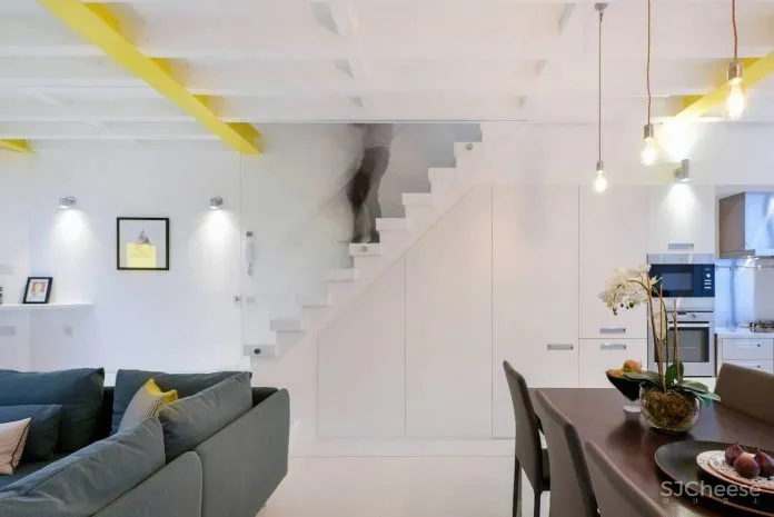 将一家旧轮胎店改造成两个设计精美的小别墅 Hogarth Architects