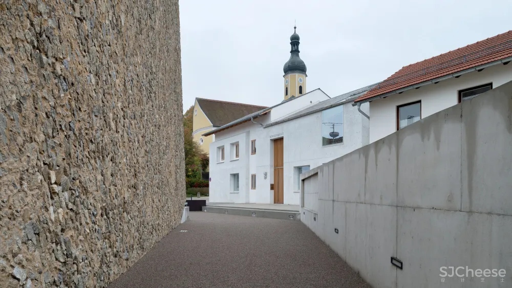 A Tilted, Submerged Concert Hall by Peter Haimerl Architektur