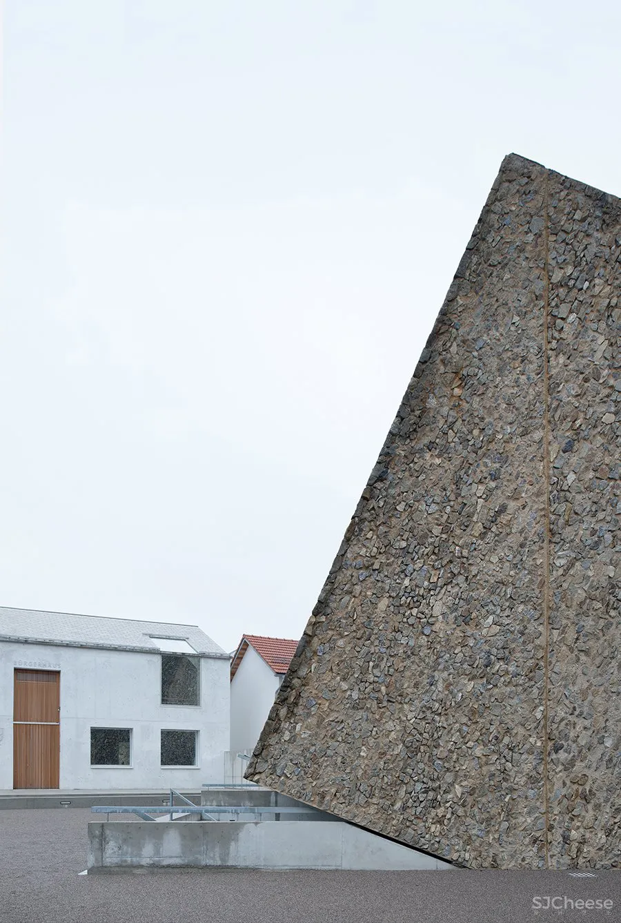 A Tilted, Submerged Concert Hall by Peter Haimerl Architektur