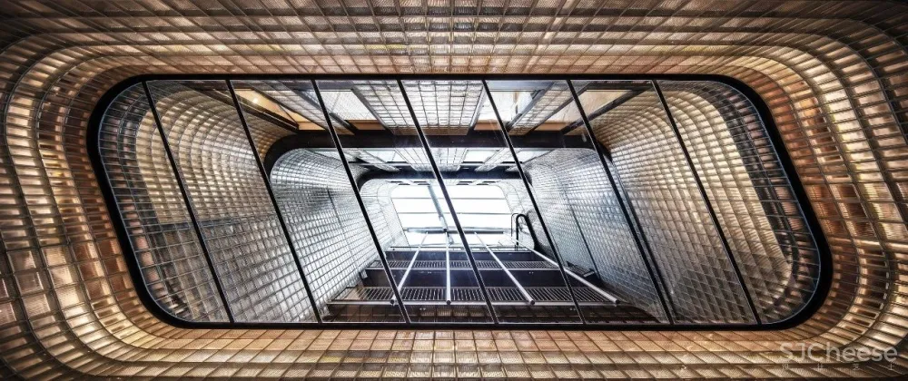 办公楼变身公寓楼,玻璃砖做的中庭,串连起空间之美!