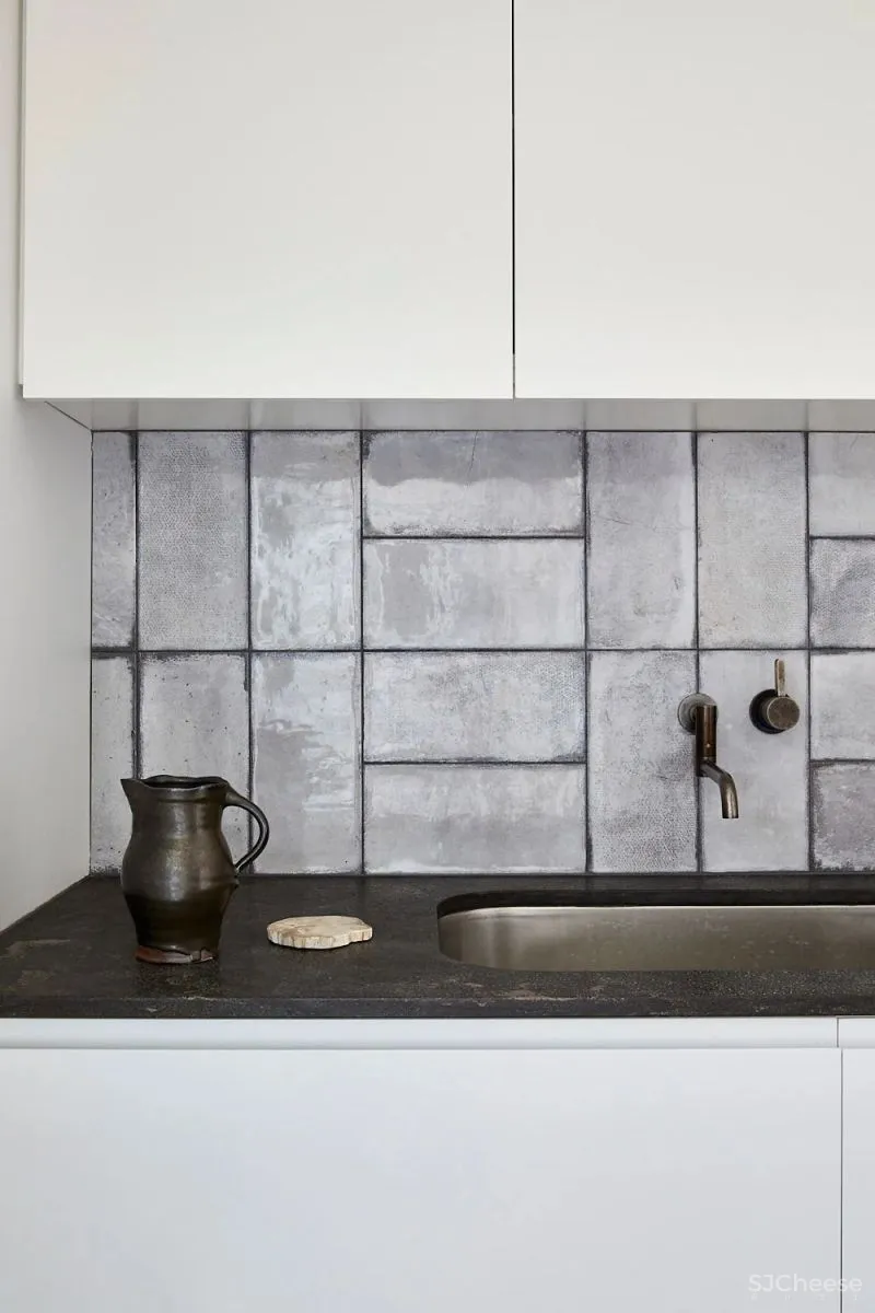 A CRAFTED LANTERN CARTHONA HOUSE BY DANIEL BODDAM STUDIO.