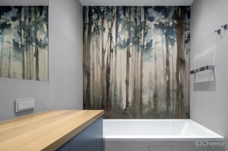 为了追求宁静的空间,设计师利用黑白灰降低家具的存在感