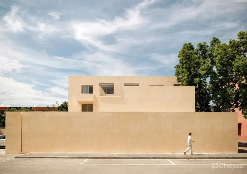 Team BLDG transforms factory bathhouse into skylit art gallery