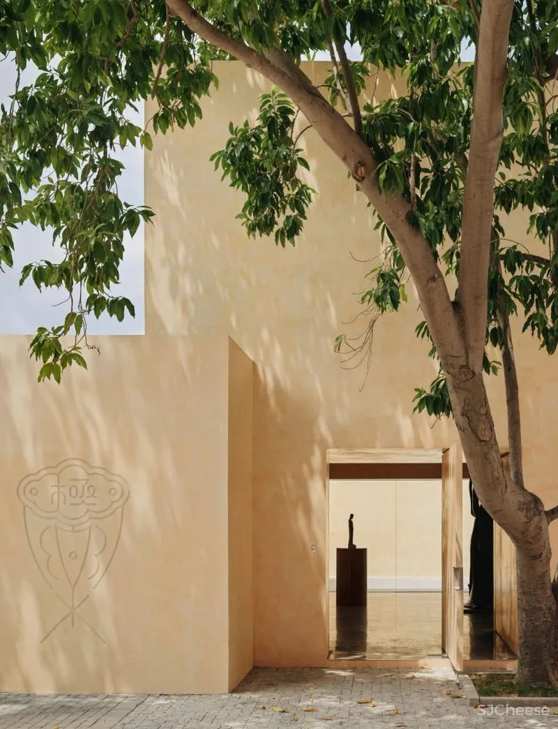 Team BLDG transforms factory bathhouse into skylit art gallery