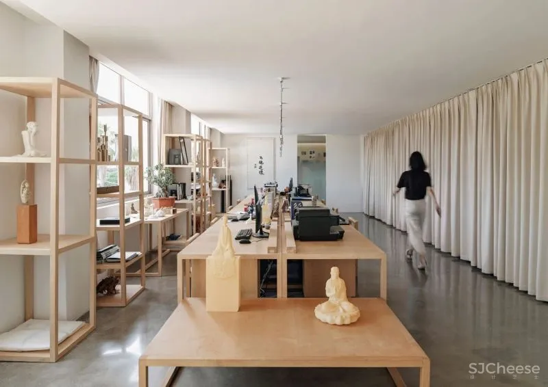 Team BLDG transforms factory bathhouse into skylit art gallery