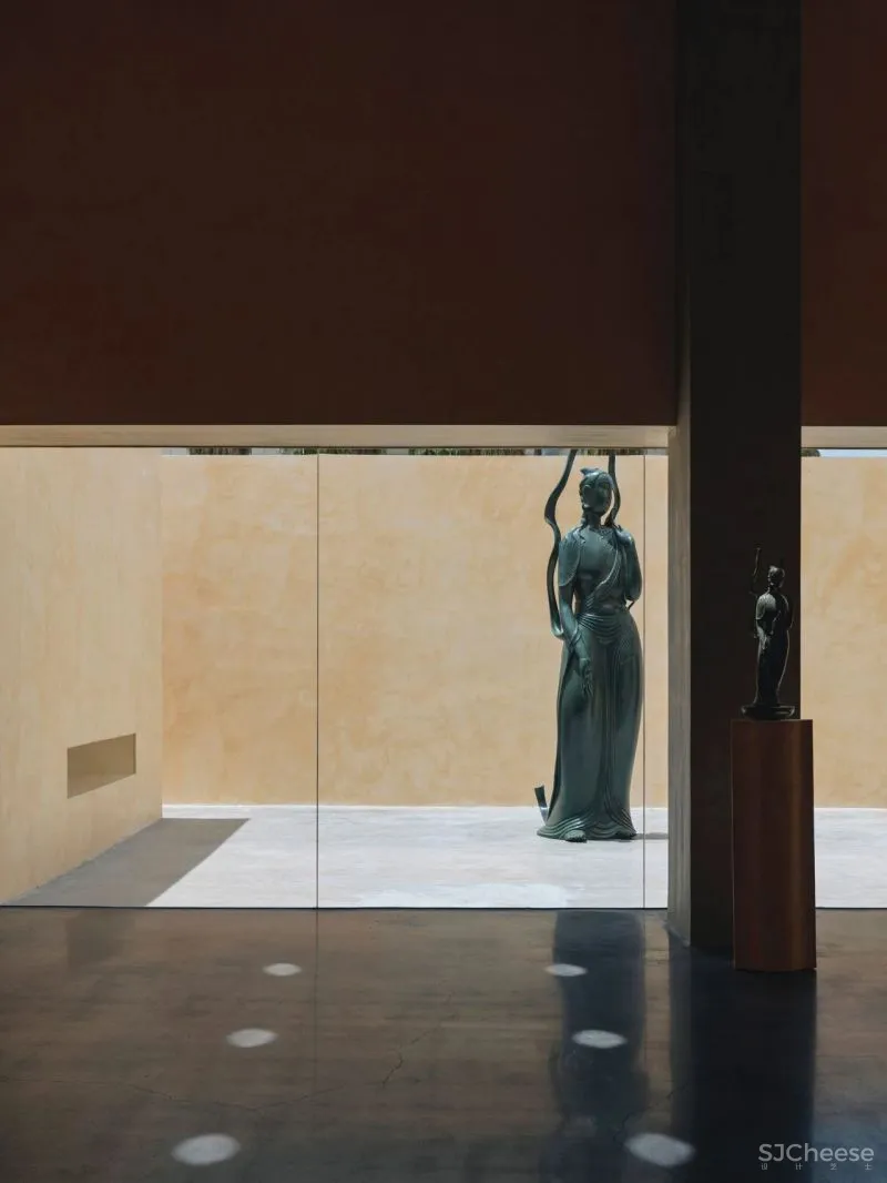 Team BLDG transforms factory bathhouse into skylit art gallery