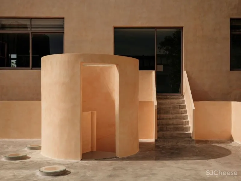 Team BLDG transforms factory bathhouse into skylit art gallery