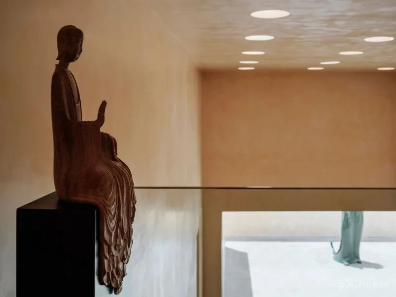 Team BLDG transforms factory bathhouse into skylit art gallery