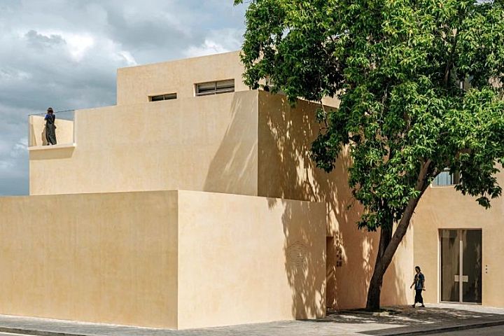 Team BLDG transforms factory bathhouse into skylit art gallery